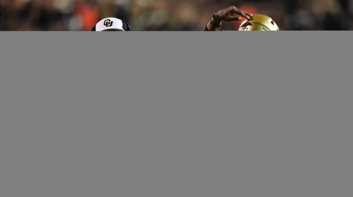 Colorado Buffaloes quarterback Shedeur Sanders (2) and head coach Deion Sanders following a two point conversion vs. Colorado State.